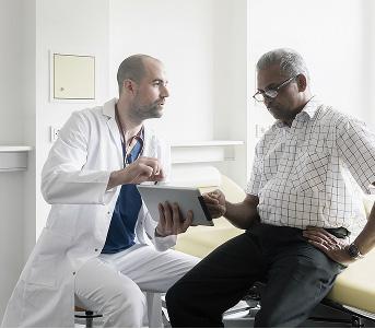 Doctor recommending PET scan with Detectnet to a patient with NETs.